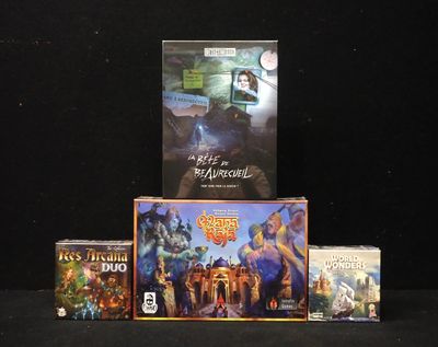 a lot of video games on display on a black table
