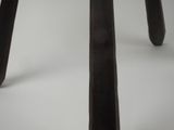 a close up of a wooden stool with a white background