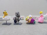 five figurines of different characters on display