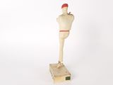 a wooden mannequin standing on top of a box
