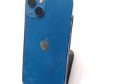 a broken iphone that is sitting on a stand