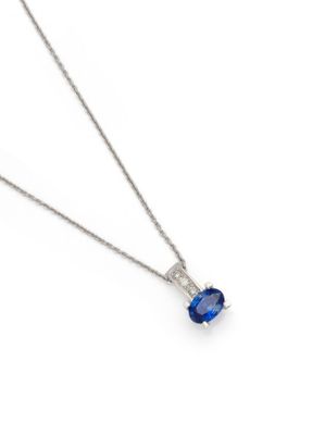 a blue sapphire and diamond pendant on a silver chain