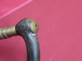a close up of a handle on a pink umbrella
