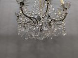 a chandelier that is hanging from the ceiling