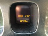 a digital clock on the dashboard of a car