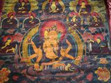 une photo d'un tableau représentant un Bouddha accroché au mur