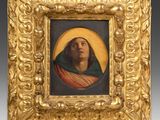 a painting of a woman in a gold frame with a green scarf
