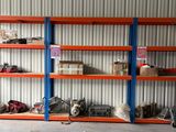 a room with a lot of shelves that have various items on them