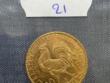 a close up of a gold coin with a label on it