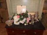 a table with a bunch of flowers on top of it