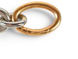 a close up of two rings on a white surface