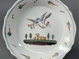 a white plate with a picture of a bird on it