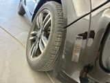 a close up of a tire on the side of a car