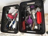 two baskets filled with different types of kitchen utensils