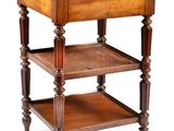 a small wooden table with a marble top on it