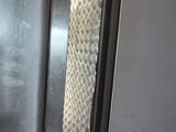 a tie hanging on the door of a train