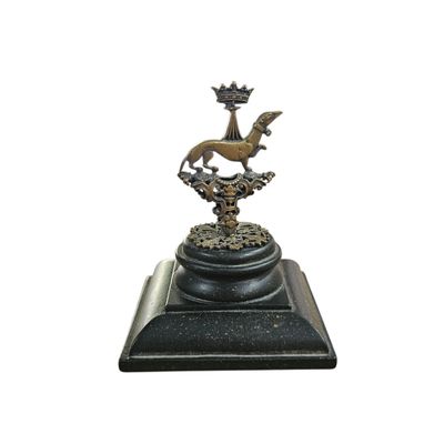 a statue of a horse with a crown on top of it
