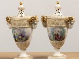 pair of antique porcelain vases with painted scenes on them