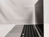 an open laptop computer sitting on top of a white table