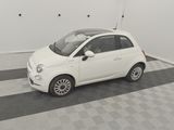 a small white car that is parked in a garage