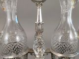 two clear glass vases on a silver tray