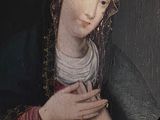 portrait of a woman in a red dress holding her hands together