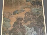 painting on the wall of a room with a painting on the wall