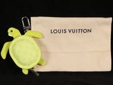 louis vuitton keychain with a turtle on top of it