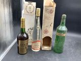 three bottles of wine sitting next to each other on a counter