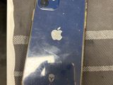 an apple iphone is sitting on top of a towel on a bed