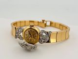 an image of a woman ' s wrist watch with diamonds on it