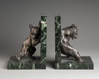 pair of bronze bookends of a cat and a dog on marble bases
