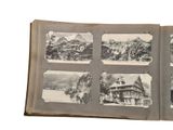 a book with pictures of a house and mountains in the background