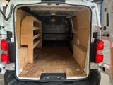 a white van with a bed in the back of it