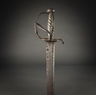 a close up of a sword on a black background