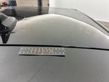 a sticker on the hood of a black car