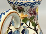 a close up of a vase with flowers on it