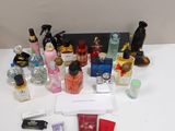 a white table with a lot of different perfumes on it