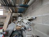 a pile of tools sitting on the floor of a building