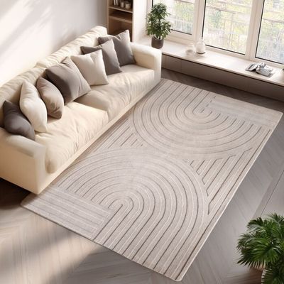 an aerial view of a living room with a couch and a rug
