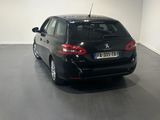 a picture of a black car parked in a garage