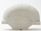 a white plate with a white design on it
