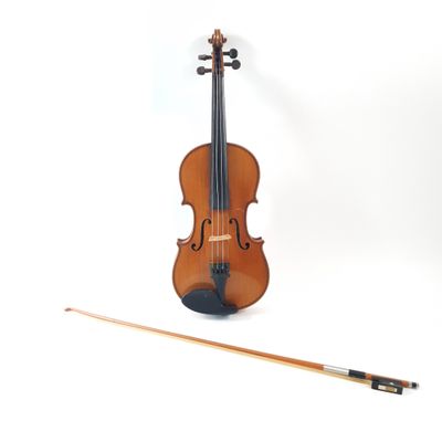 a violin that is sitting next to a bow