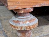 a close up view of a wooden table with a wooden top