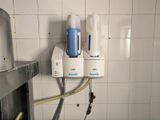 a water dispenser that is attached to a wall