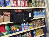 a shelf with many different items in it in a store