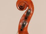 an old violin with a wooden back and a long neck