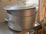 a large pot sitting on top of a table in a kitchen