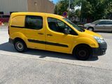 a yellow van that is parked on the side of the road