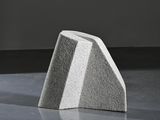 an image of a concrete block sitting on top of a cement floor